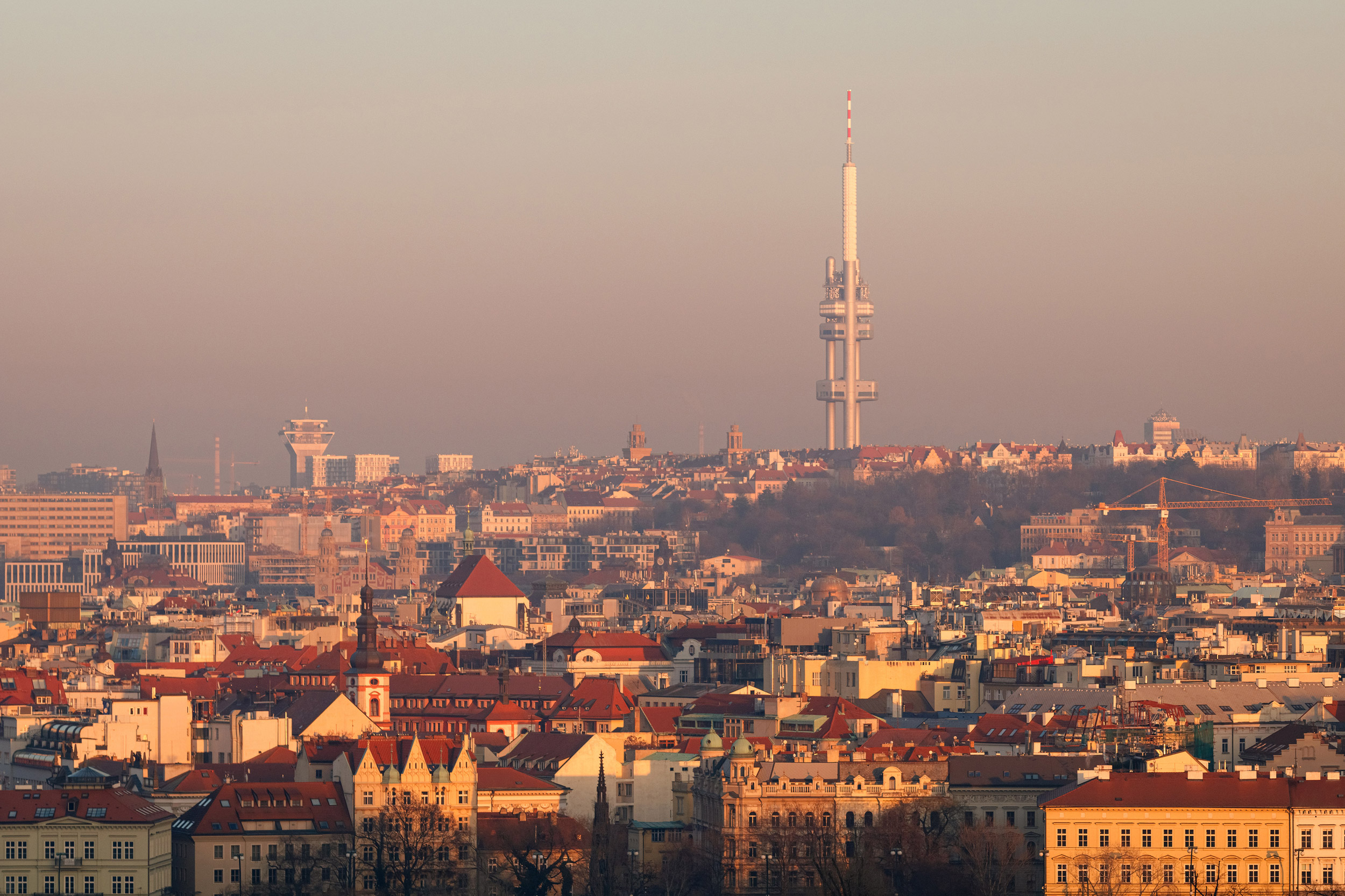 Beautiful winter sunset view on Zizkov television tower and city