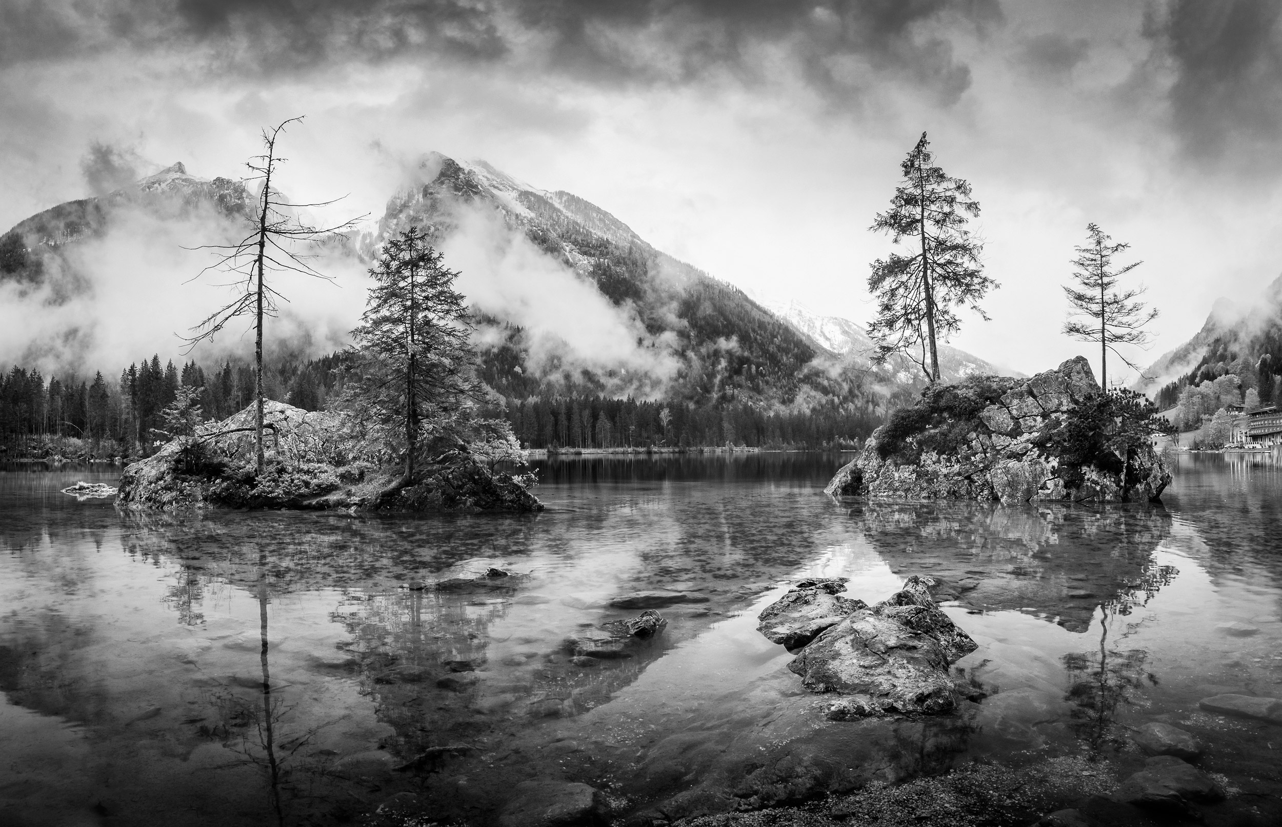 Misty summer morning on the Hintersee lake in German Alps