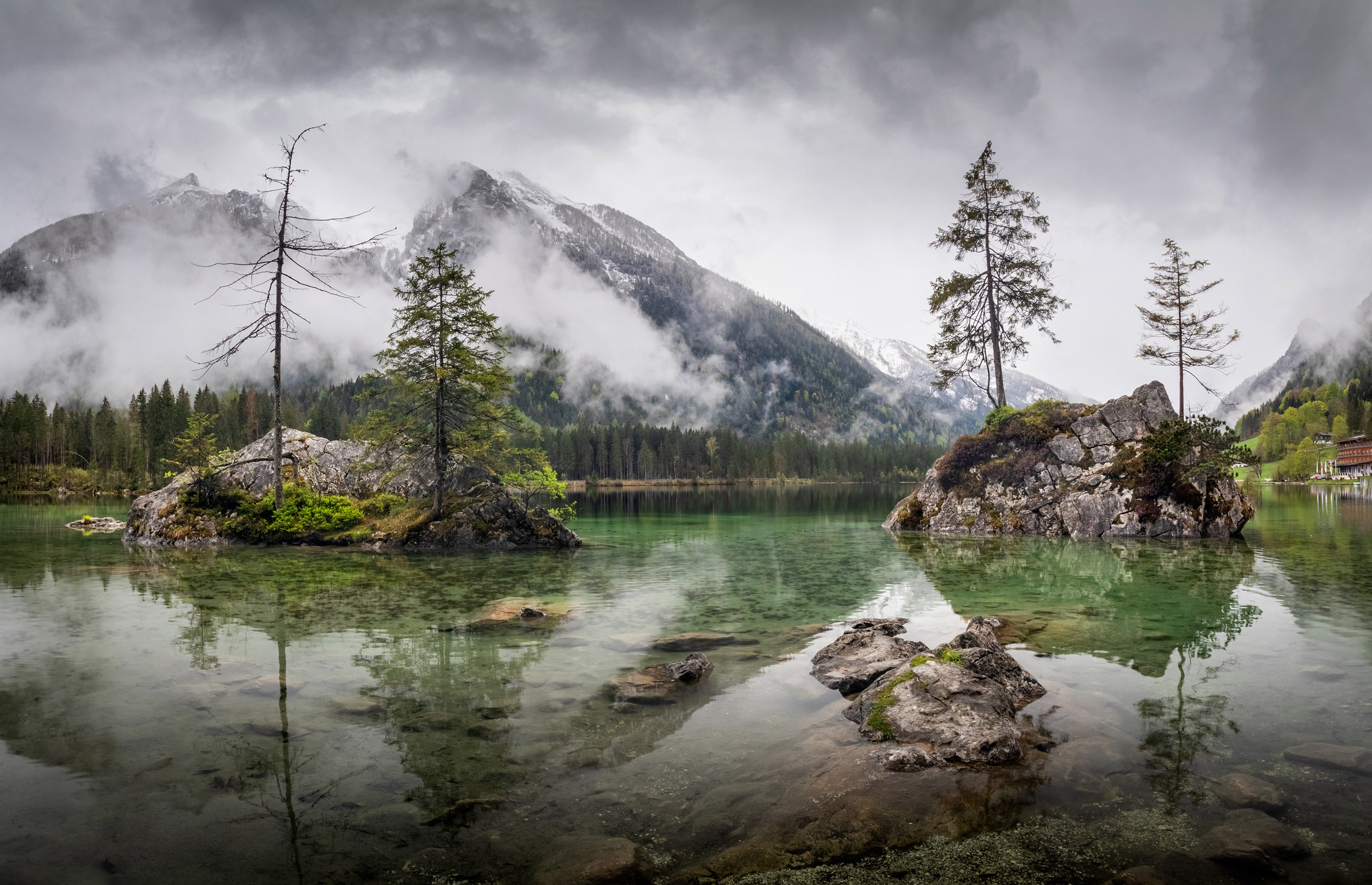 Misty summer morning on the Hintersee lake in German Alps