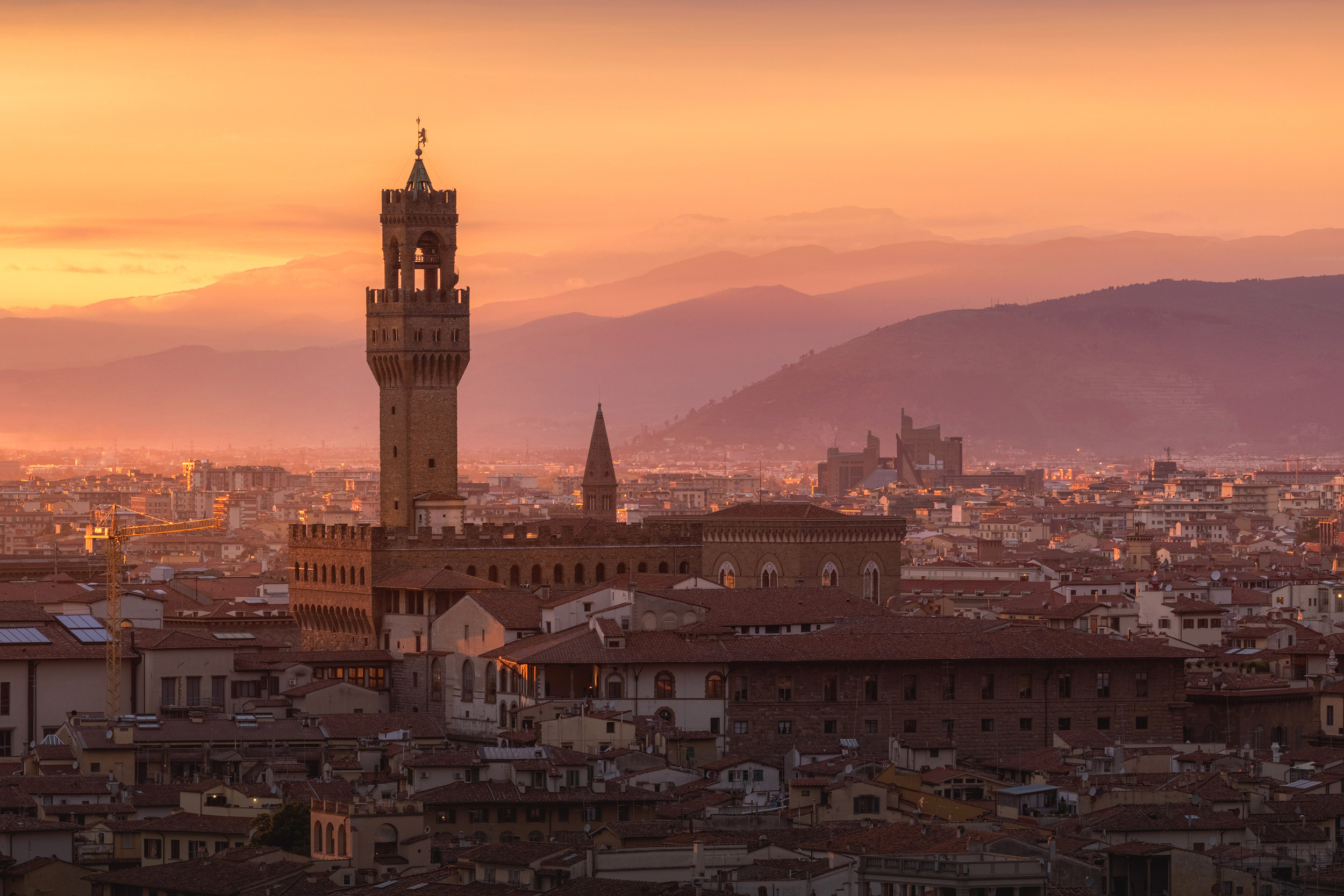 Cityscape of Florence with Palazzo Vecchio illuminated at the su