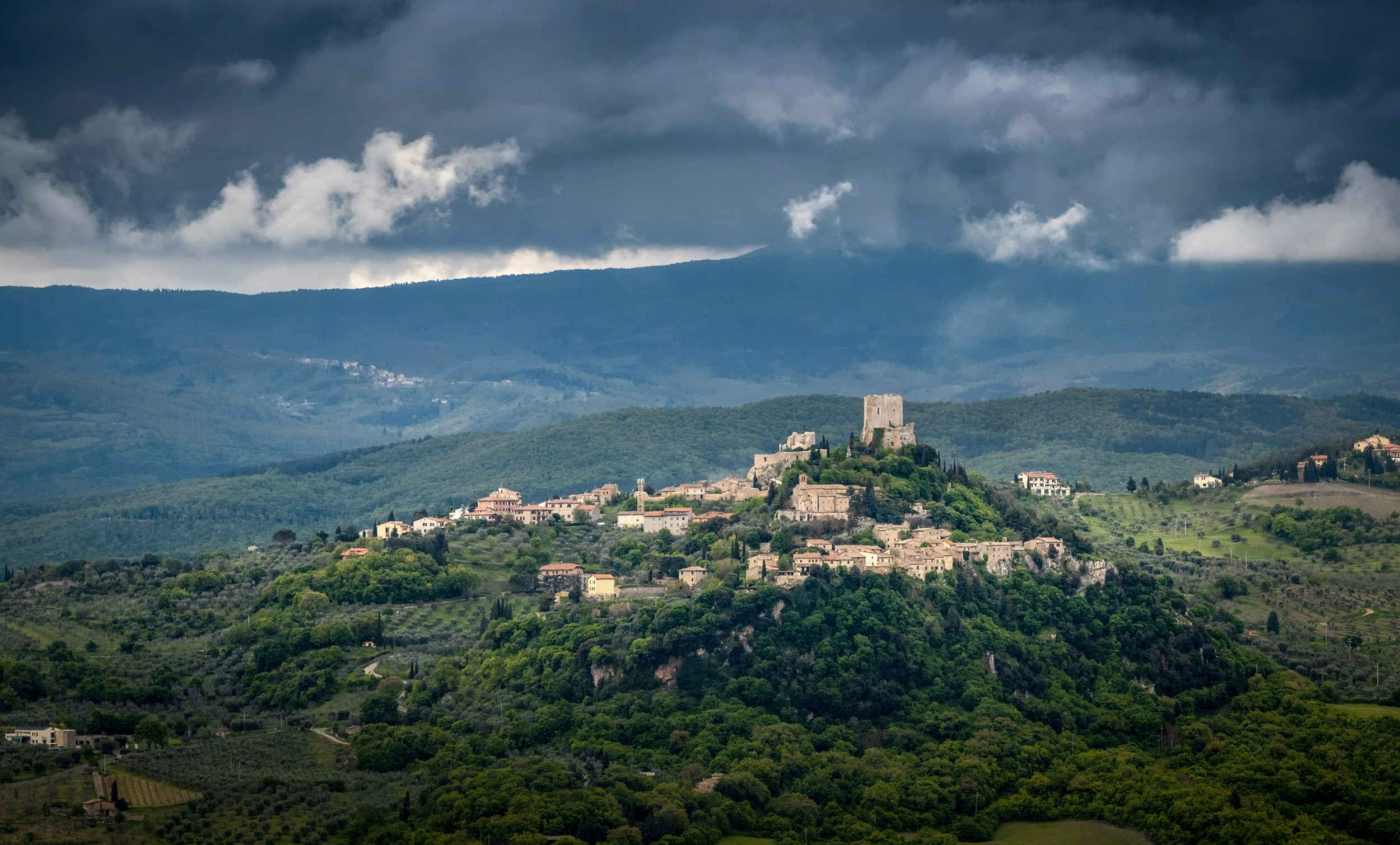 VAL D ORCIA, TUSCANY – MAY 04, 2019: Storm over small city of Ca