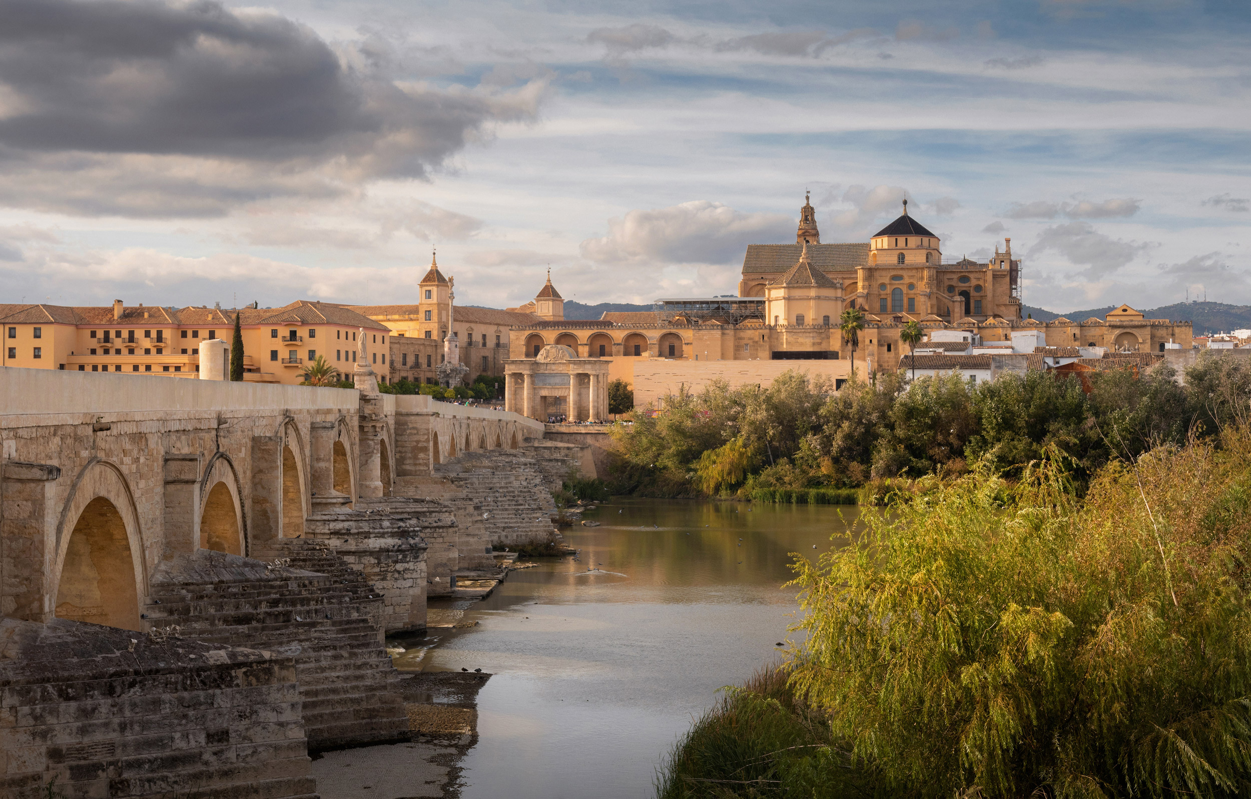 Roman Bridge and Guadalquivir river at the sunset, Great Mosque,