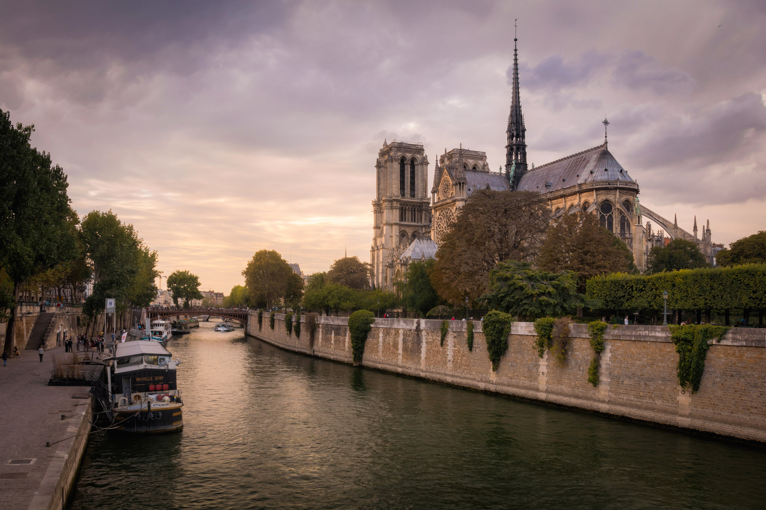 Seine and romantic cathedral Notre Dame at the sunset, Paris, Fr