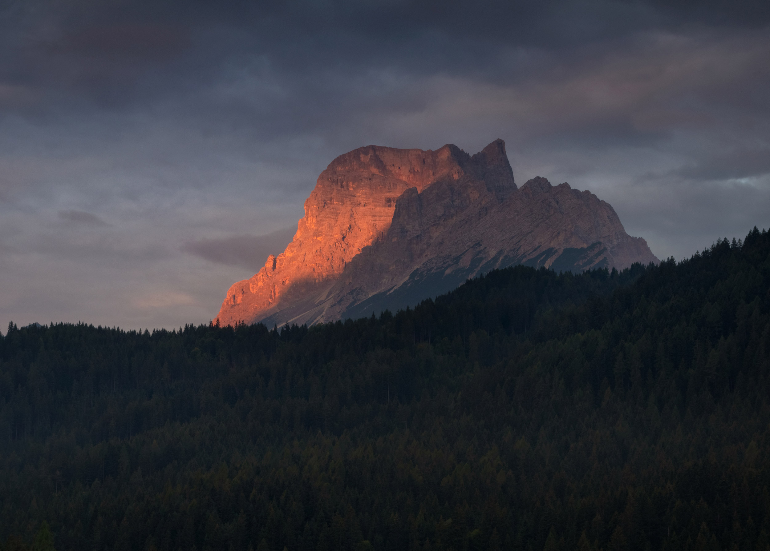 Famous Dolomites mountain peak glowing in beautiful golden eveni