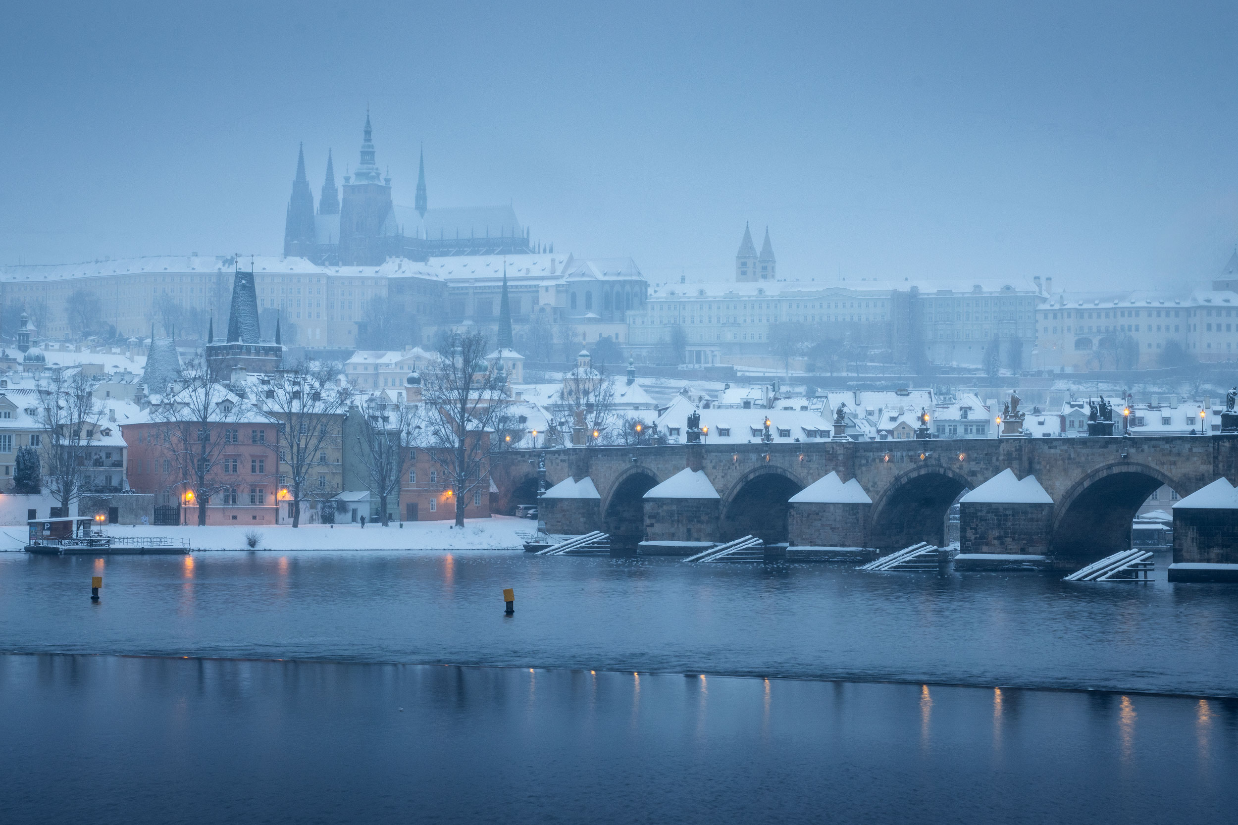 Charles Bridge over the Vltava river in winter fog, Prague